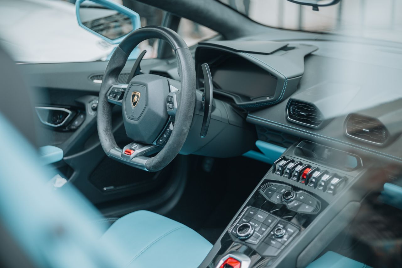 team-03 Explore the sleek interior of a luxury sports car shot in Cluj-Napoca, Romania, showcasing modern design and sophistication.